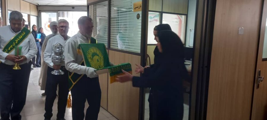 ملارد | پرچم گردانی حرم مطهر امام رضا (ع) در اداره بهزیستی