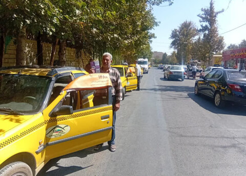نظرآباد | اهداء آفتابگیر تبليغاتى خط ۱۴۸۰ و معرفى خط ١٢٣ به تاكسى هاى نظرآباد